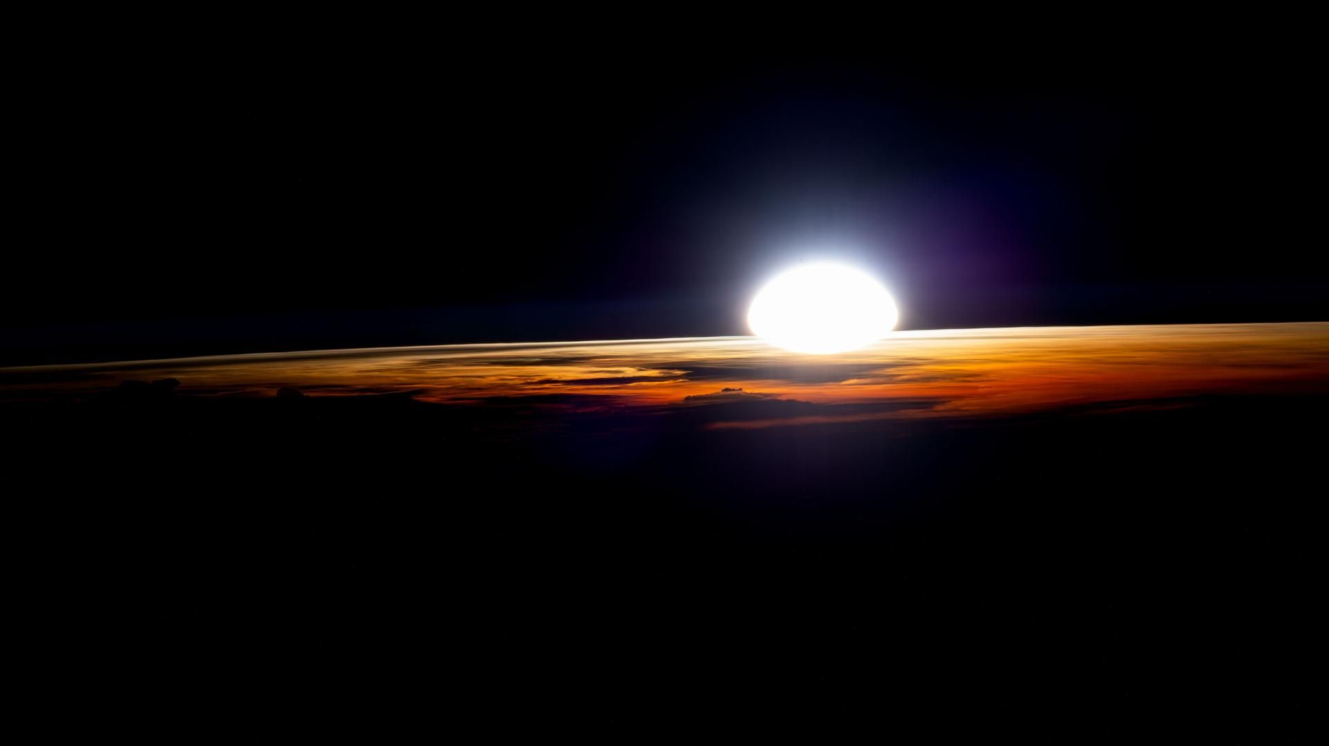 The sun rising over Earth's horizon above Namibia, seen from the International Space Station.
